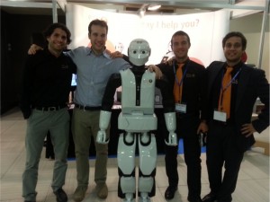 PAL Robotics' team standing with REEM-C