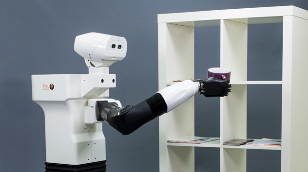 The mobile manipulator robot TIAGo grabbing a mug from a shelf