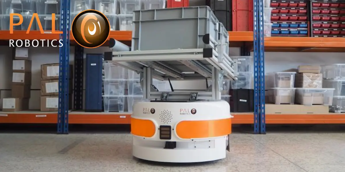 The autonomous mobile robot (AMR) TIAGo Base carrying a box providing industry 4.0 solutions automating deliveries