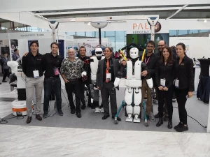 The President of Boston Dynamics Marc Raibert with PAL Robotics' team and TALOS and REEM-C