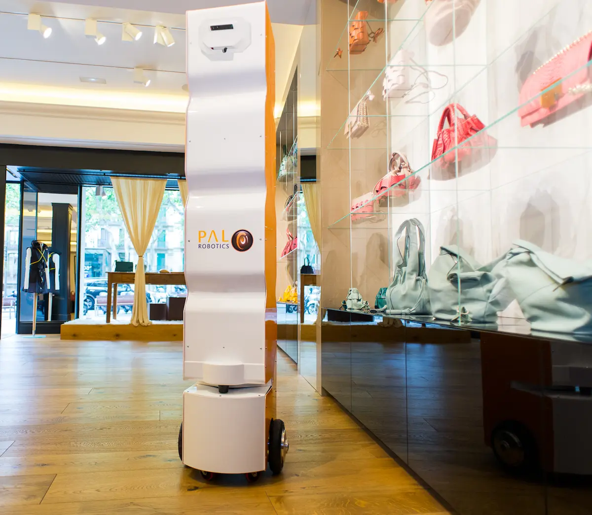 The retail robot StockBot tracking inventory in a clothes shop