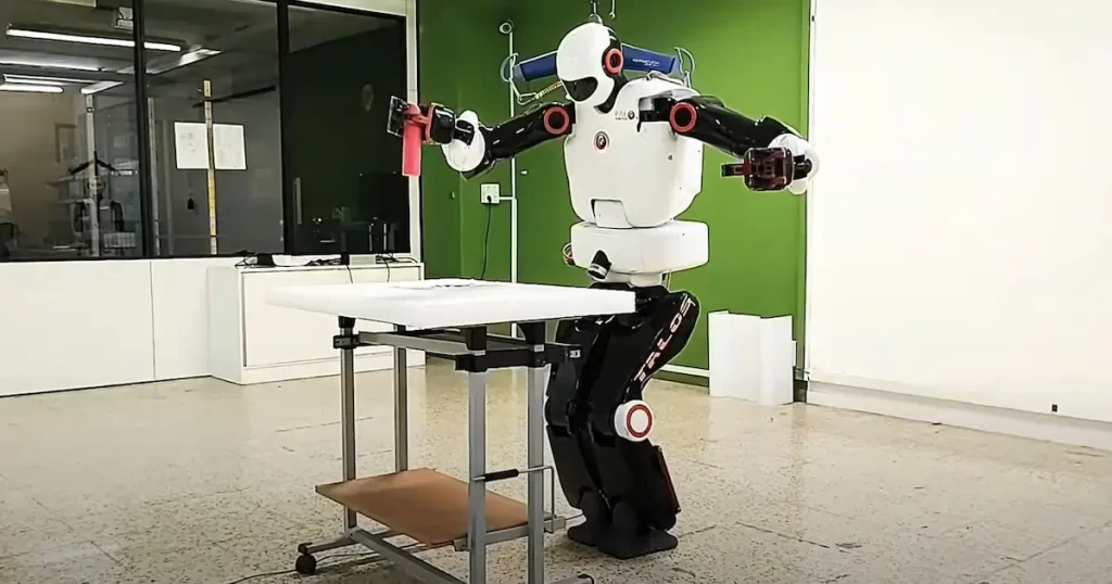 The research platform TALOS robot grabbing an object