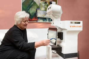 During Project SANDRO, TIAGo robot helps an elderly woman