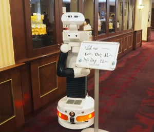 TIAGo robot welcoming visitors to RosMoSys