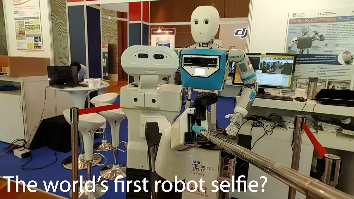 The mobile manipulator robot TIAGo takes the world's first robot's selfie