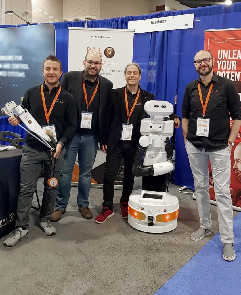 PAL Robotics' team with TIAGo robot at ICRA 2022