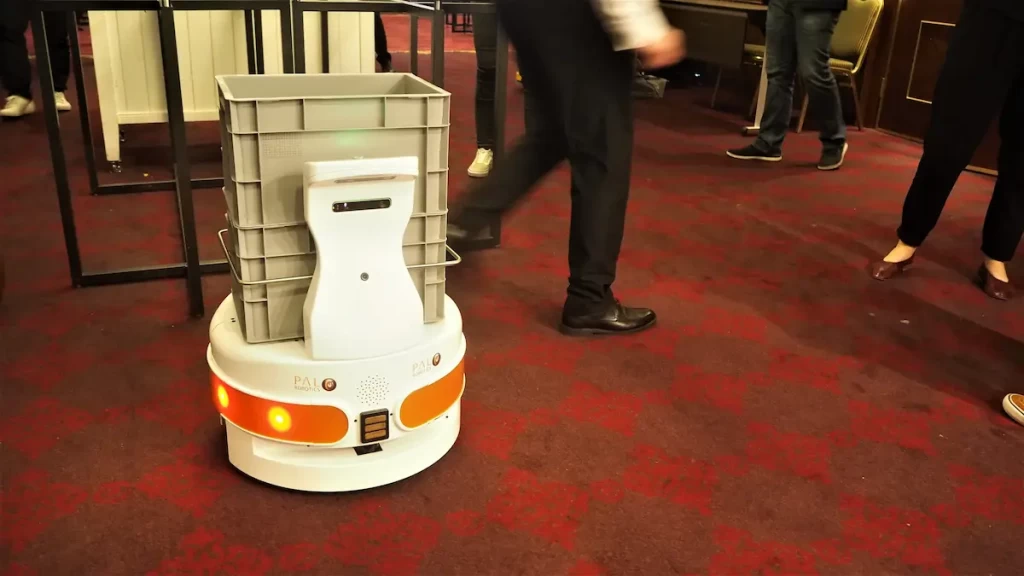 The autonomous mobile robot (AMR) TIAGo Base with a crate