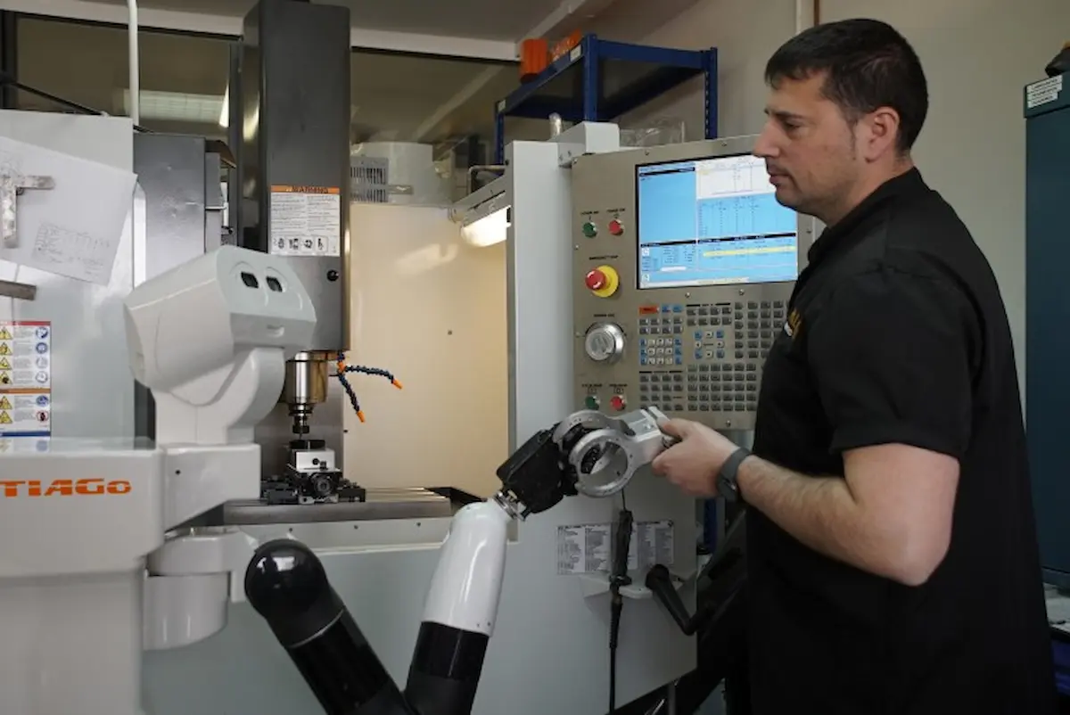 TIAGo robot collaborating with a technician