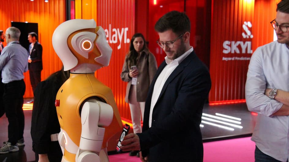 The humanoid social robot ARI interacting with a young man at IOT Solutions World Congress